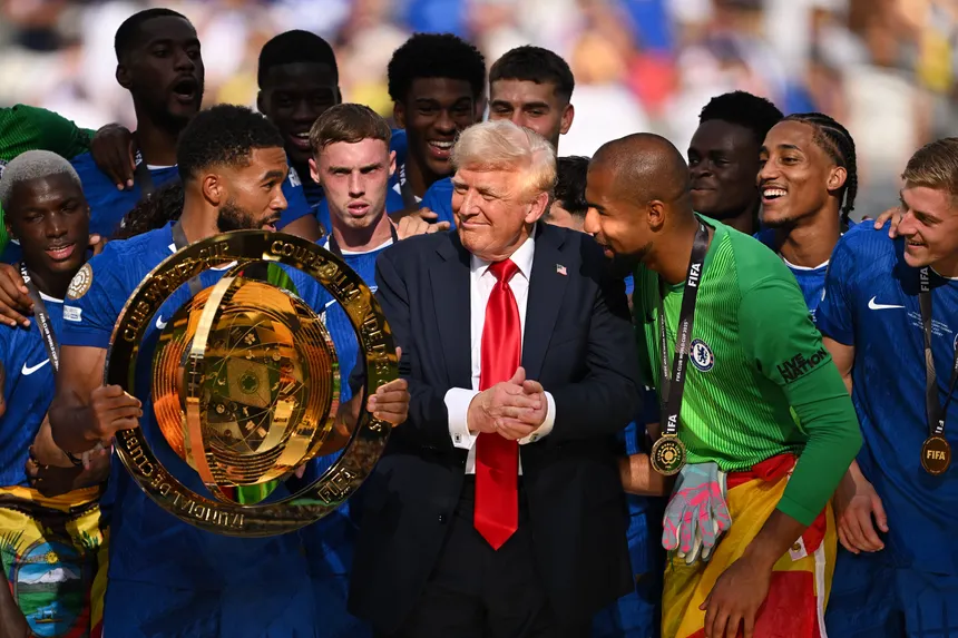 Chelsea players celebrate their Club World Cup triumph with Donald Trump at MetLife Stadium, marking the moment the team received a replica trophy after Trump stole the original trophy
